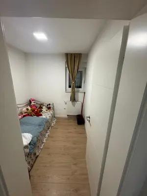 a small room with a bed and a hallway at Stan na dan Jelah in Jelah