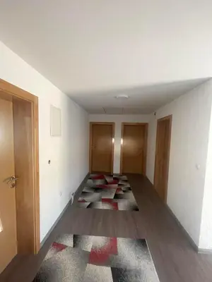 an empty room with a rug on the floor at Porodični mir in Bugojno
