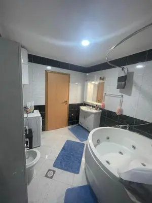 a bathroom with a tub and a toilet and a sink at Porodični mir in Bugojno