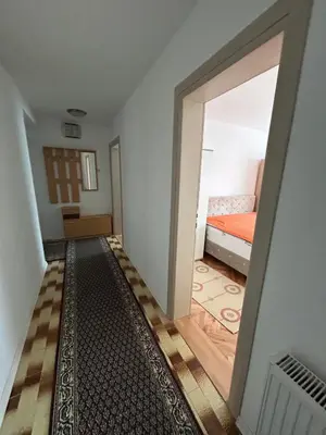 a hallway with a door leading to a bedroom at Apartman Andja in Laktaši