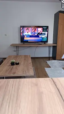 a living room with a television on a table at Galija in Velika Kladuša