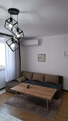 a living room with a couch and a coffee table at Galija in Velika Kladuša