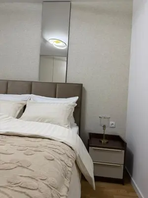 a bedroom with a large bed with white pillows at Stelmar Apartment in Banja Luka