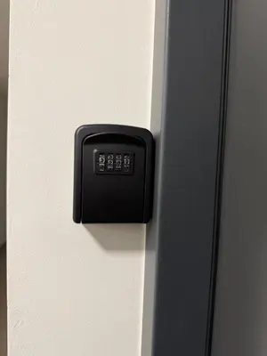 a black button on the side of a door at Stelmar Apartment in Banja Luka