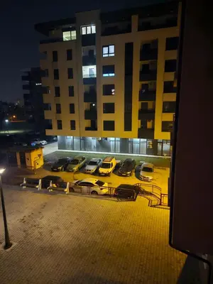a group of cars parked in a parking lot at Apartman Magic in Banja Luka