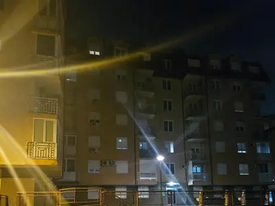 a building with a street light in front of it at night at Apartman Magic in Banja Luka