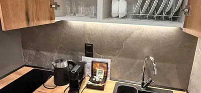 a kitchen counter top with a sink and a sink at Nikstudio in Banja Luka