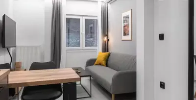 a living room with a couch and a table at Nikstudio in Banja Luka