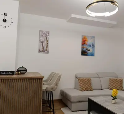 a living room with a couch and a table at Apartman Andrija in Banja Luka