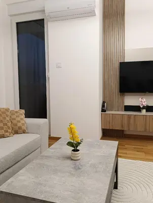 a living room with a couch and a table at Apartman Andrija in Banja Luka
