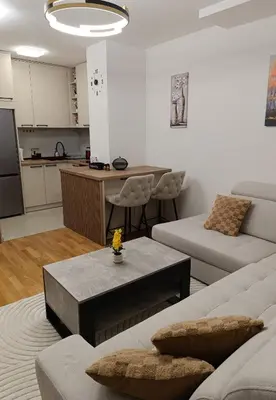 a living room with a couch and a table at Apartman Andrija in Banja Luka