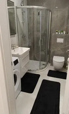 a bathroom with a shower and a toilet and a sink at Apartman Andrija in Banja Luka