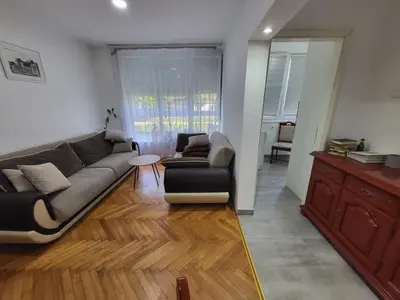 a living room with a couch and a table at Stan na dan Gradiska