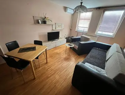 a living room with a couch and a table at Stan na dan Gradiska