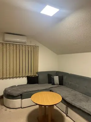 a living room with a couch and a table at Apartments Aventra in Visoko