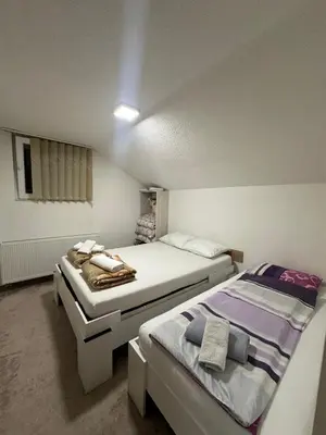 a bedroom with two beds in a room at Apartments Aventra in Visoko