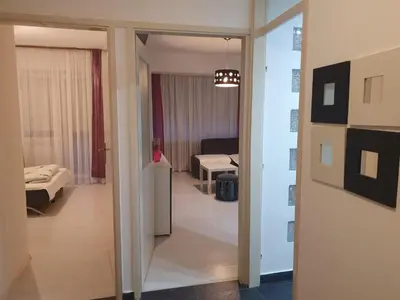 a hallway leading to a room with a bedroom at Apartman Magelan in Bosanska Gradiška