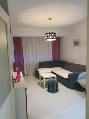 a living room with a couch and a table at Apartman Magelan in Bosanska Gradiška