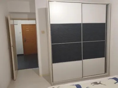 a sliding glass door with a mirror in a room at Apartman Magelan in Bosanska Gradiška