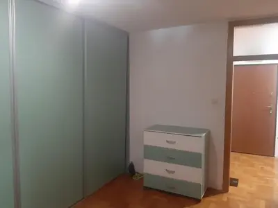 an empty room with a dresser and a closet at Apartment No1 in Banja Luka