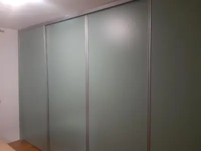 a sliding glass closet door in a room at Apartment No1 in Banja Luka