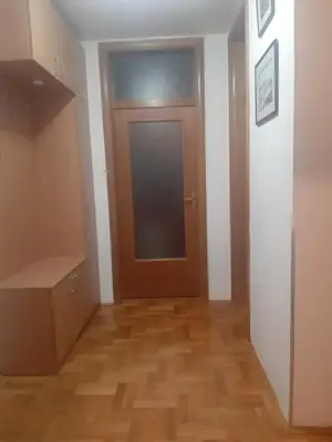 a hallway with a door and a wooden floor at Apartment No1 in Banja Luka