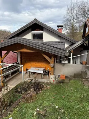 a house with a roof with a picnic table at Wooden house Tešanj in Tešanj