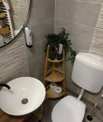 a bathroom with a white sink and a mirror at Apartman Slapovi in Banja Luka