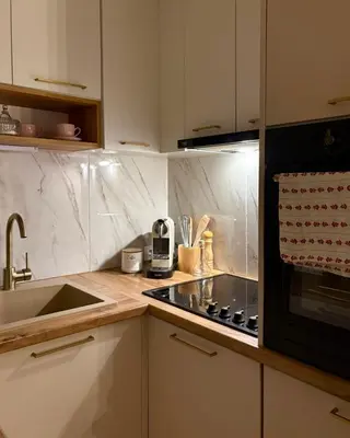 a kitchen with a sink and a stove top oven at Apartman Slapovi in Banja Luka