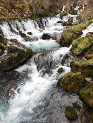 a stream of water rushing over rocks in a river at Apartman Slapovi in Banja Luka