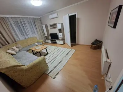a living room with a couch and a table at Stan na dan Čaršija in Gračanica