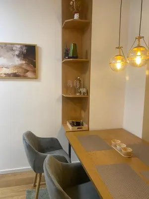 a dining room with a wooden table and chairs at D&Ana in Banja Luka