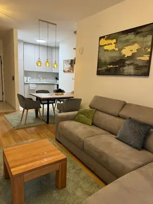 a living room with a couch and a table at D&Ana in Banja Luka