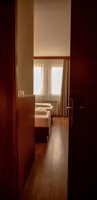 a room with two beds and a window at New Lake in Laktaši
