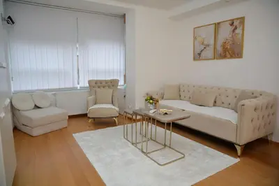 a living room with a couch and a table at Elite Centar Lux in Banja Luka