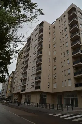 a large apartment building on the side of a street at Elite Centar Lux in Banja Luka