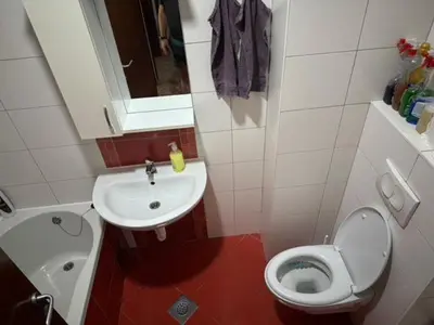a small bathroom with a toilet and a sink at Trojka in Banja Luka