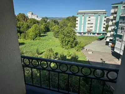 a balcony with a view of a green field at Trojka in Banja Luka
