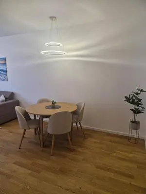 a dining room with a table and chairs at Stay & Enjoy Apartment in Banja Luka