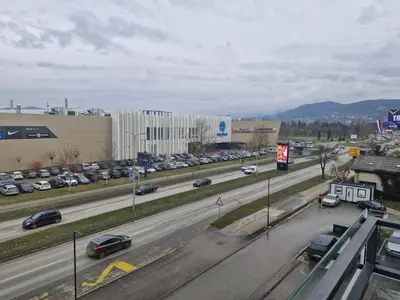 a highway with cars parked in a parking lot at Stay & Enjoy Apartment in Banja Luka