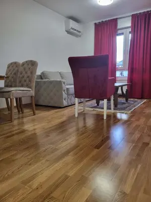 a living room with a couch and a chair at Apartment Dora 3 in Banja Luka
