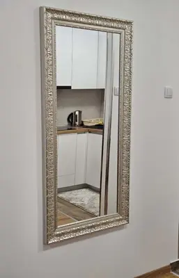 a mirror hanging on a wall in a room at Apartment Dora 3 in Banja Luka