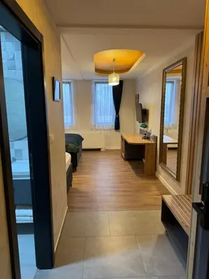 a hallway of a living room with a mirror at Pansion Afitos in Laktaši