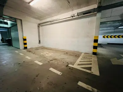 an empty parking garage with an empty parking lot at Apartman Tara 23 in Banja Luka