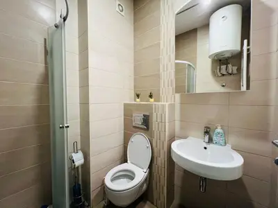 a small bathroom with a toilet and a sink at Apartman Tara 23 in Banja Luka