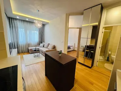 a living room with a couch and a table at Apartman Tara 23 in Banja Luka