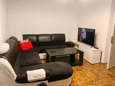 a living room with a couch and a tv at Vrbas in Banja Luka