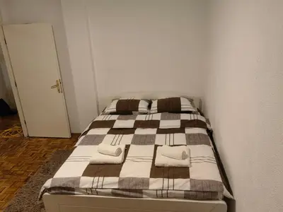 a bedroom with a bed with towels on it at Vrbas in Banja Luka