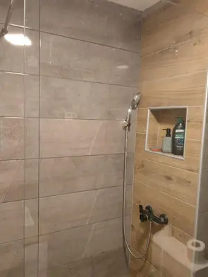 a bathroom with a shower with a glass door at Vrbas in Banja Luka