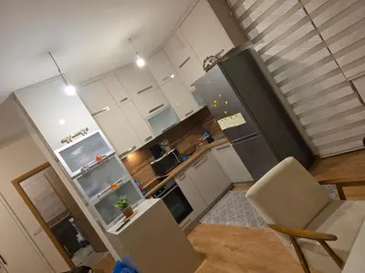 an overhead view of a kitchen with white cabinets at Stan na dan -Lukavac in Lukavac